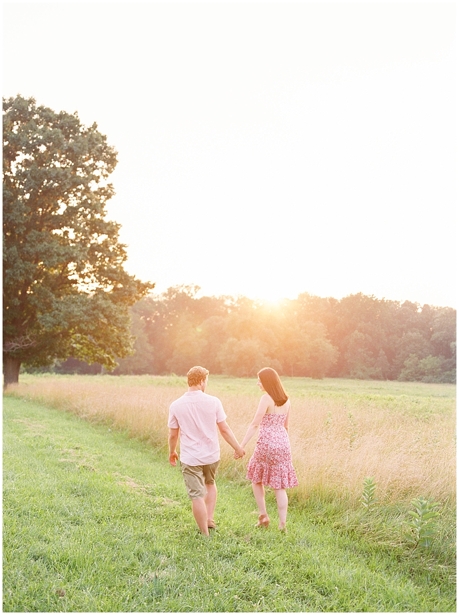 Summer, Valley Forge Pennylvania engagement session with green fields and a stunning golden hour by film photographer Hillary Muelleck
