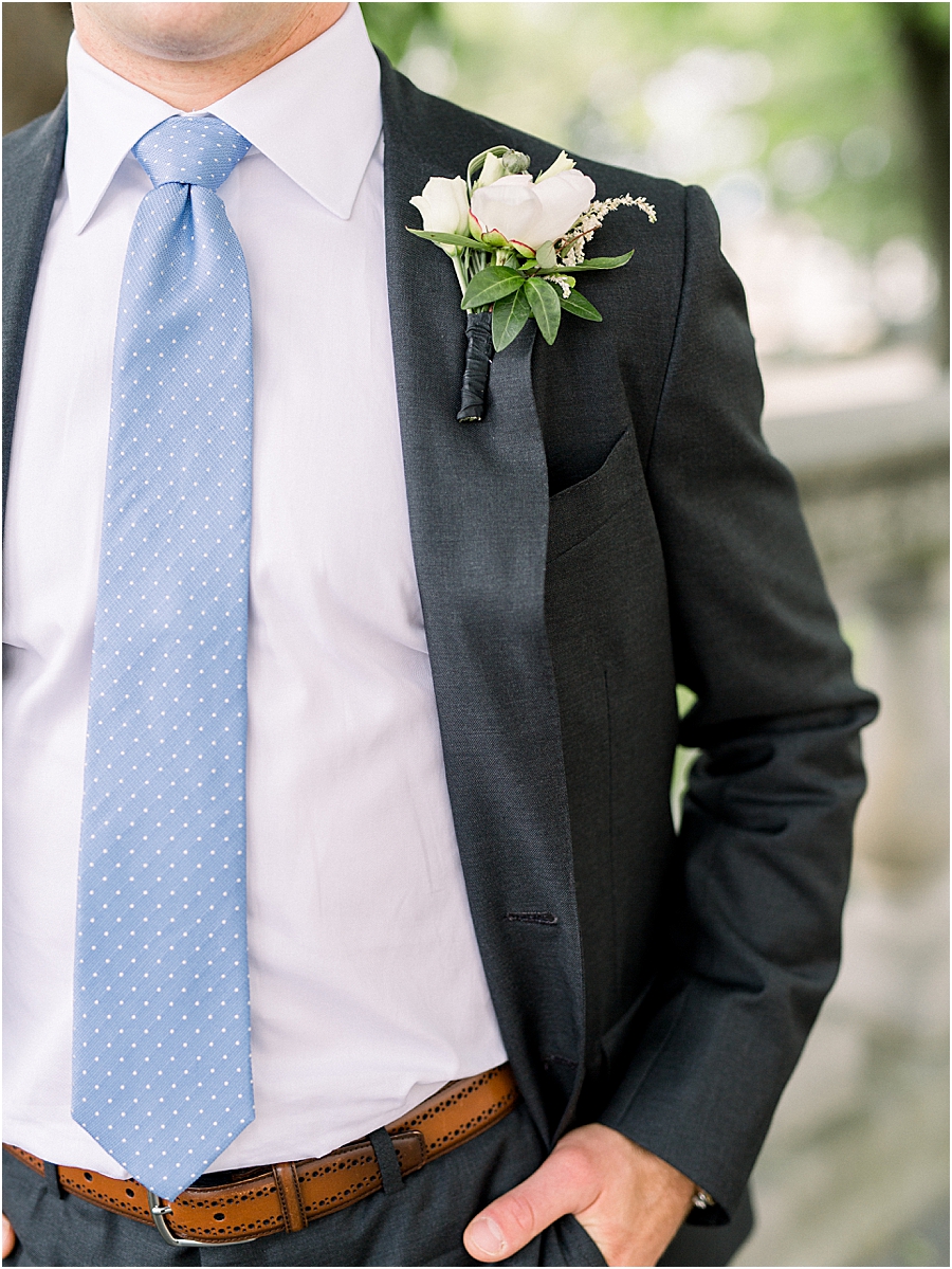 Groom details with dark grey suit and blue tie at Pennsylvania State Capitol Wedding