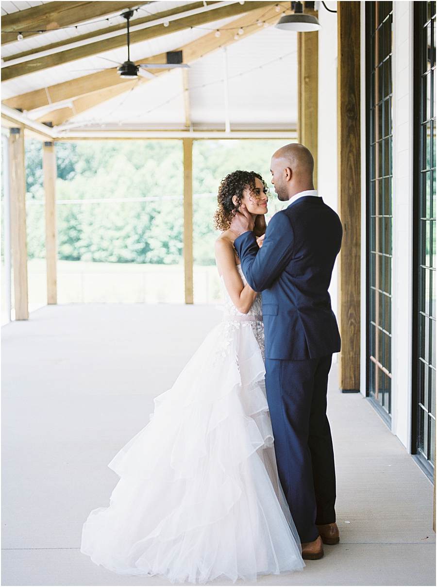 Bride and Groom with pink floral gown at Board and Batten Events Wedding, Modern Barn Inspiration by Hillary Muelleck