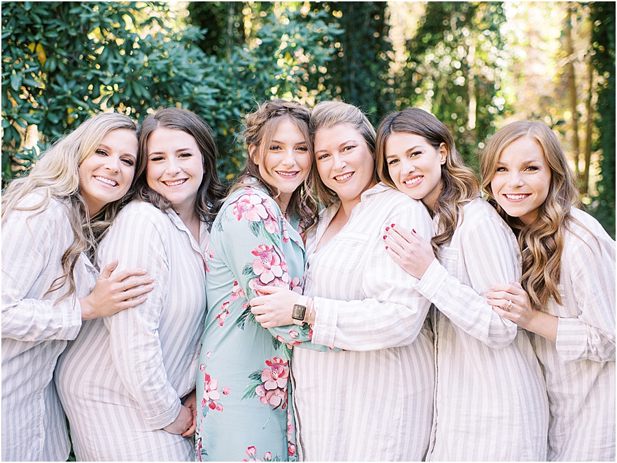 Bride and bridesmaids getting ready in cute striped pajamas- North Carolina Wedding Venue Hawkesdene in the Fall by Hillary Muelleck
