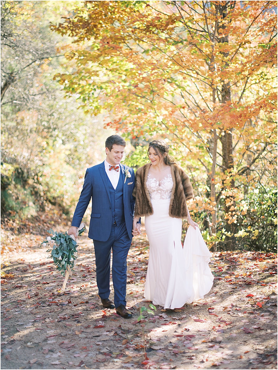 Bride and Groom in Fall leaves- North Carolina Wedding Venue Hawkesdene in the Fall by Hillary Muelleck